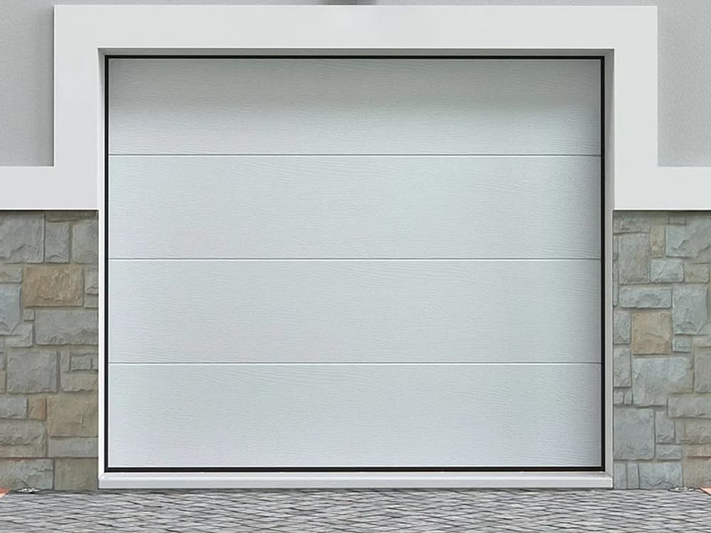 Portone sezionale bianco installato su un garage